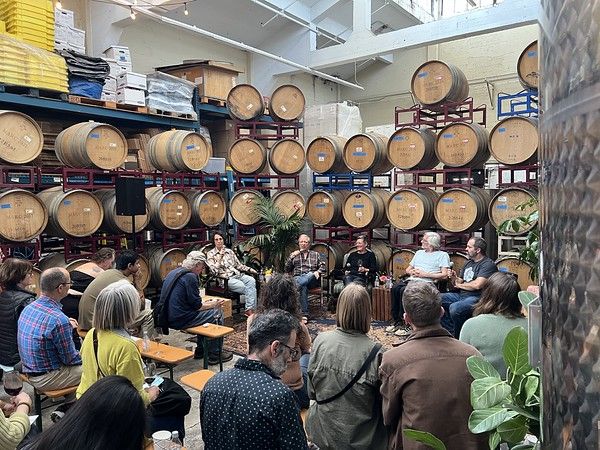 Panel audience among the barrels at the first UNFILTERED