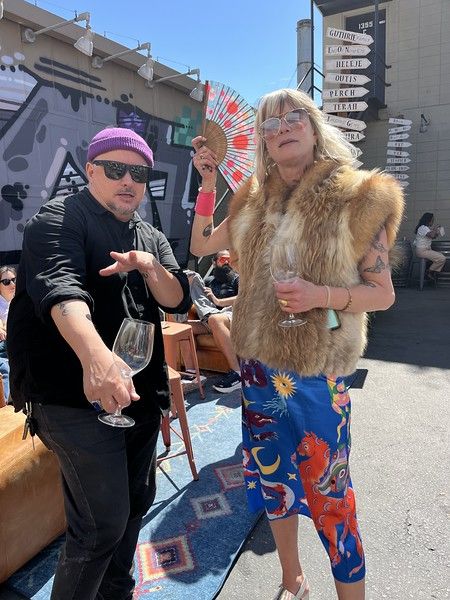 Guests in a fur vest and printed pants