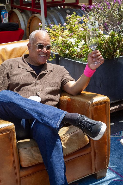 A guest relaxing in a leather armchair
