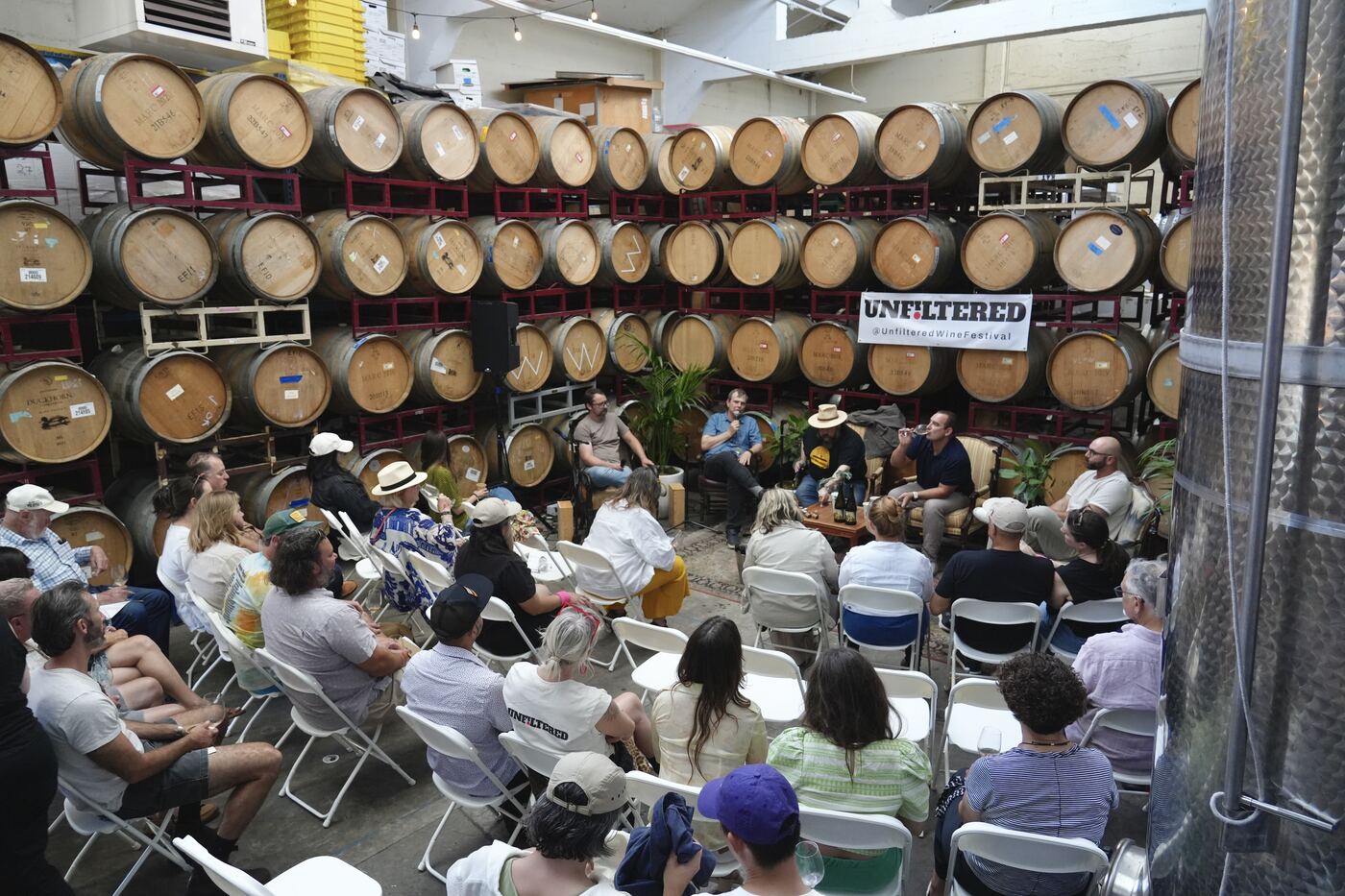 A standing-room crowd for a panel among the barrels