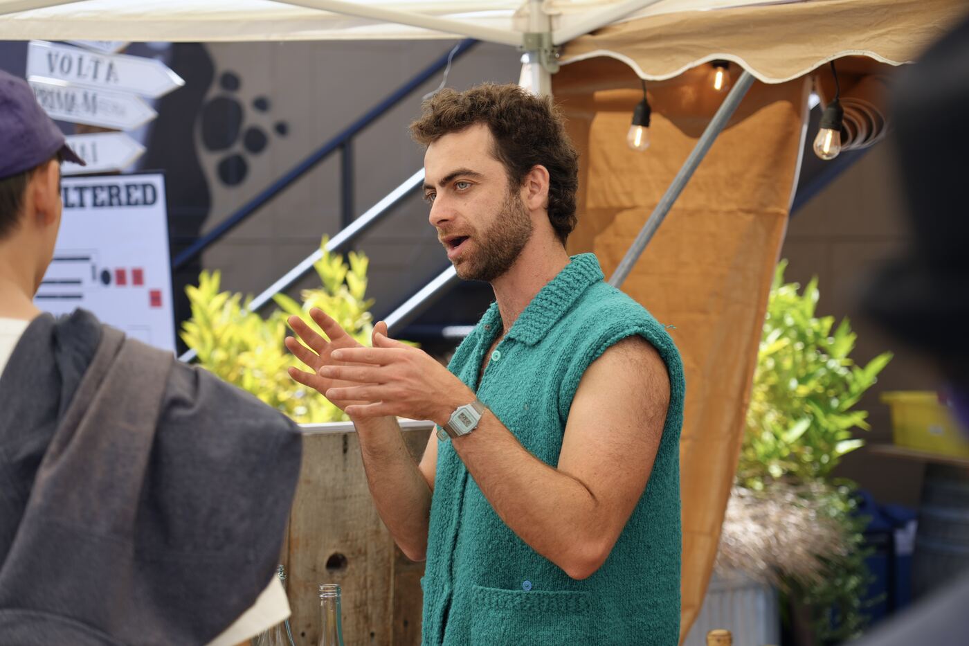 A winemaker talking with guests